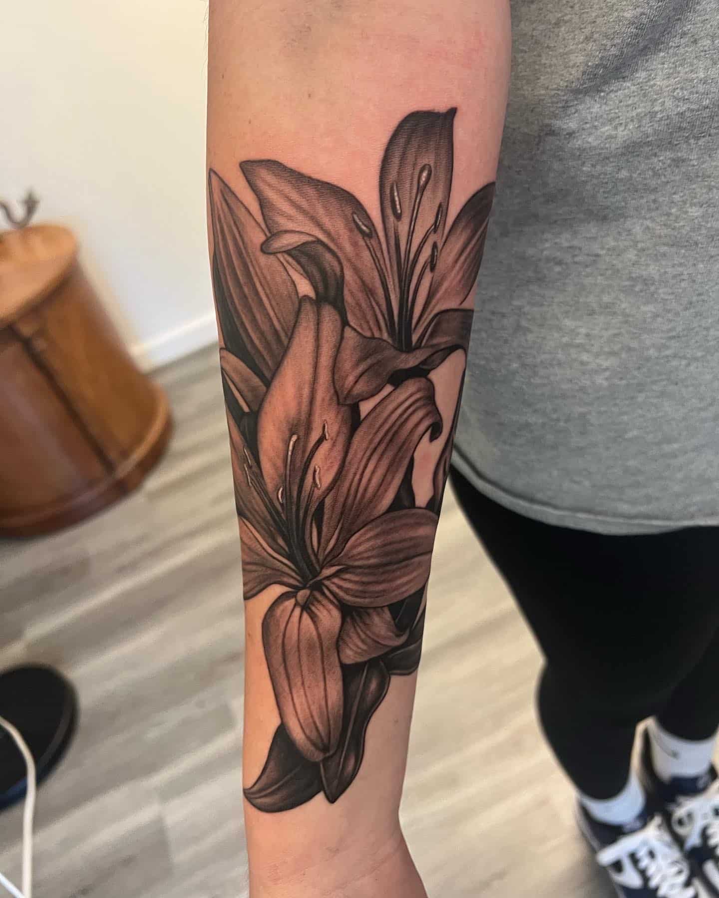 black-and-grey-lily-flowers-tattoo-by-josh-hibbard