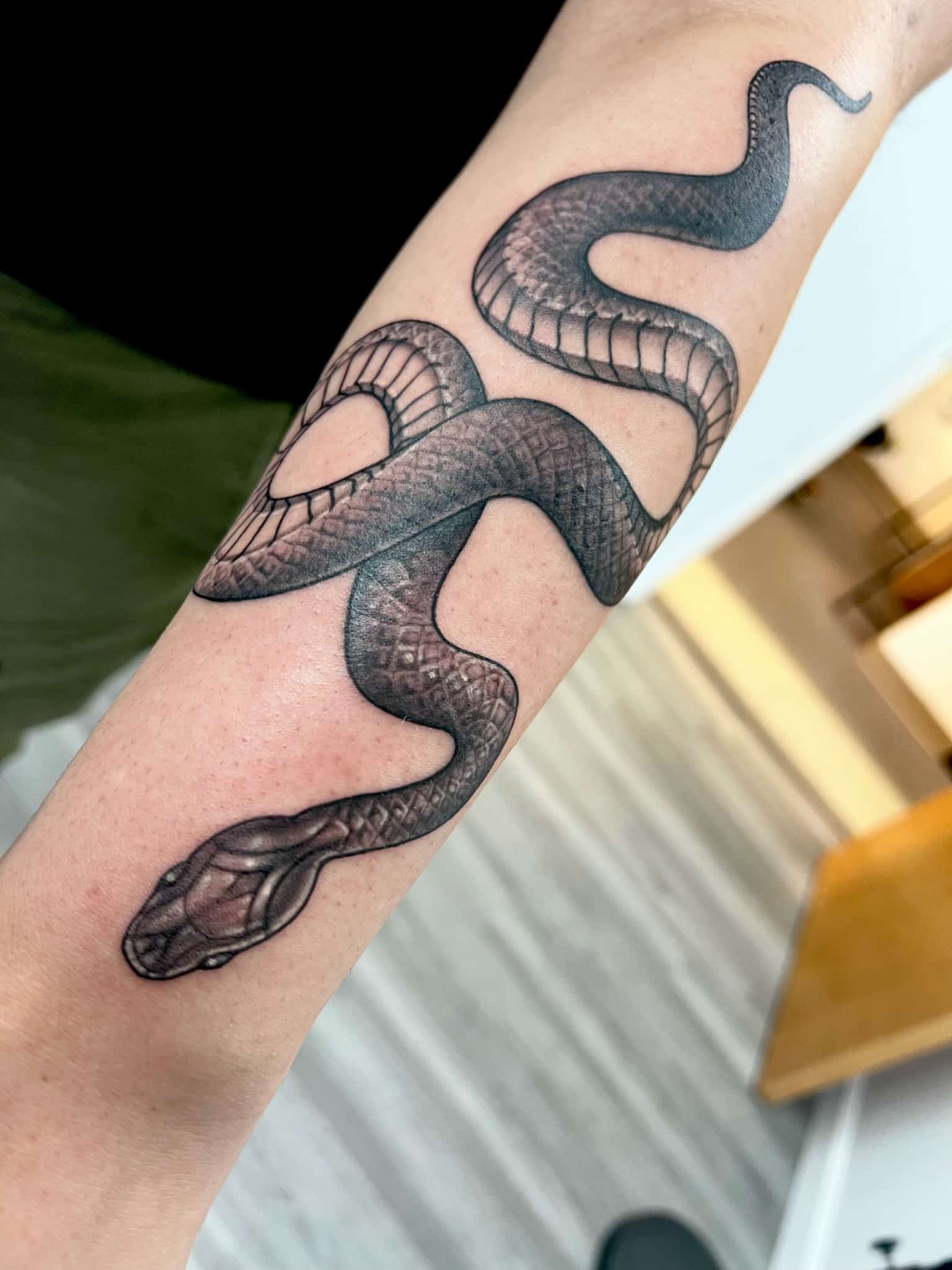 black-snake-forearm-tattoo-by-josh-hibbard